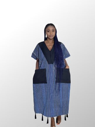 Woman wearing a blue Aso Oke Bubu dress with intricate patterns”