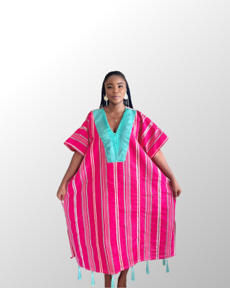 Model wearing a pink aso oke with green tassles