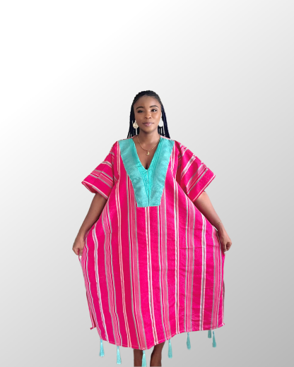 Model wearing a pink aso oke with green tassles