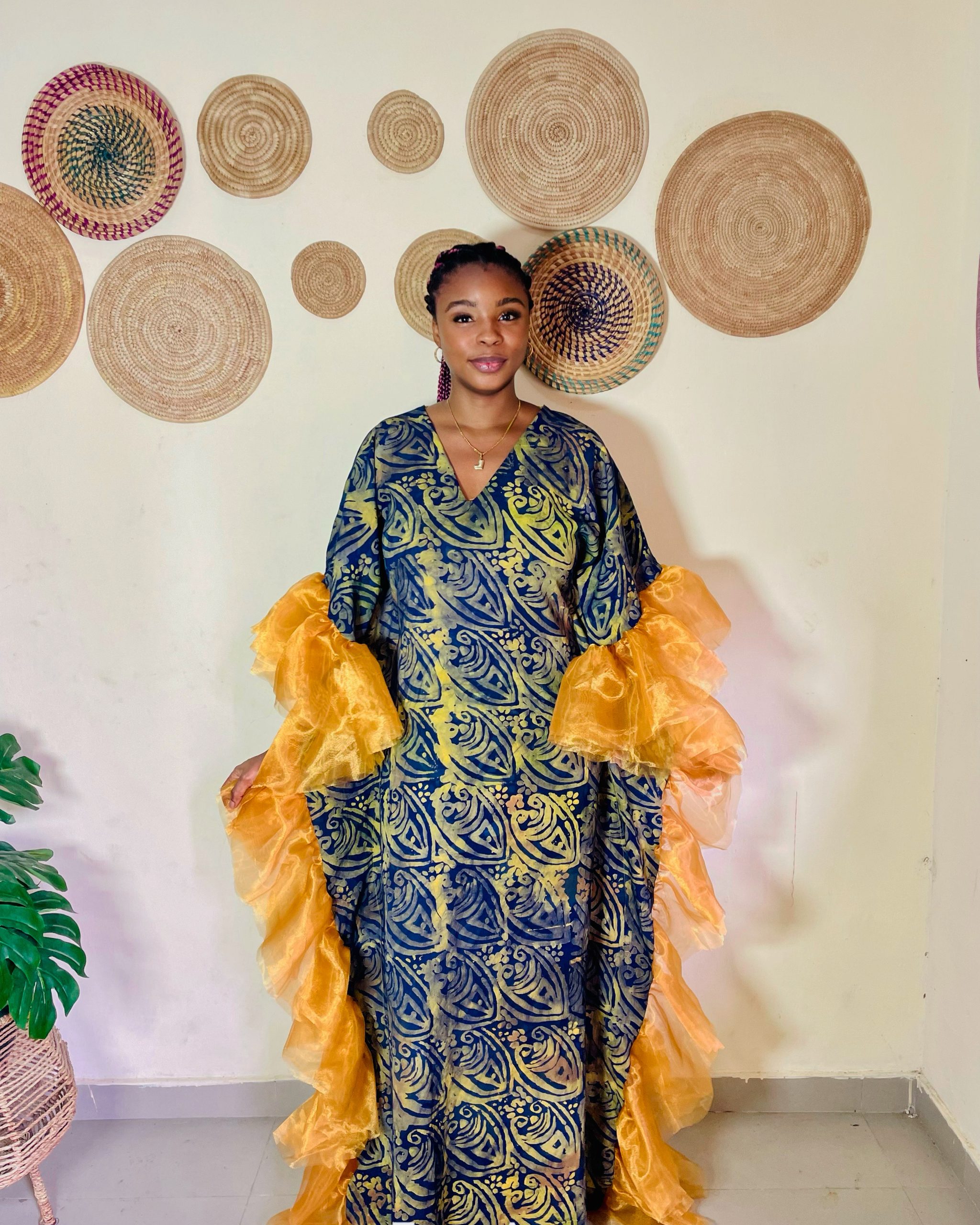 “Roma Adire dress with dramatic side ruffles, handmade from traditional Adire fabric for a bold and elegant look.”