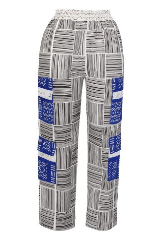 Ankara cargo pants with 4 functional pockets, designed in bold African print fabric on a clean white background